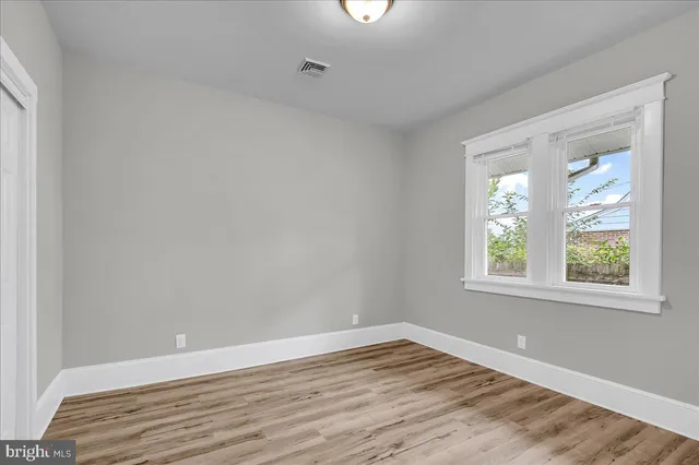 a view of an entryway with wooden floor