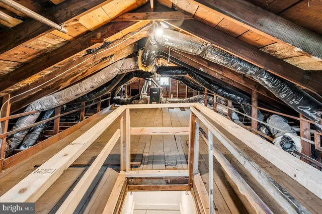a view of empty room with wooden ceiling