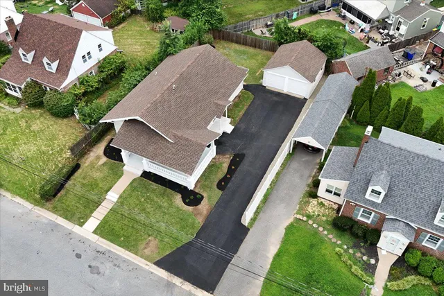 an aerial view of a house with a yard and a garden