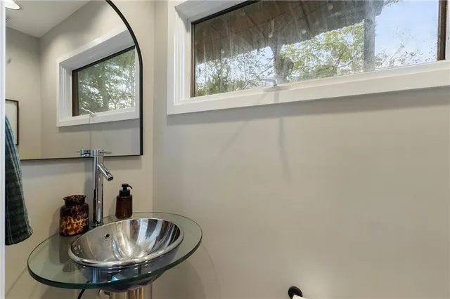 a bathroom with a sink and a window