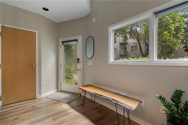 a bedroom with a bed and a potted plant