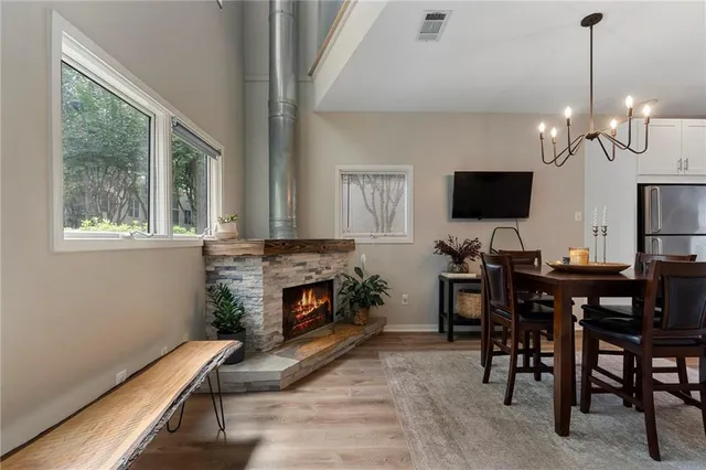 a view of a livingroom with furniture and a fireplace
