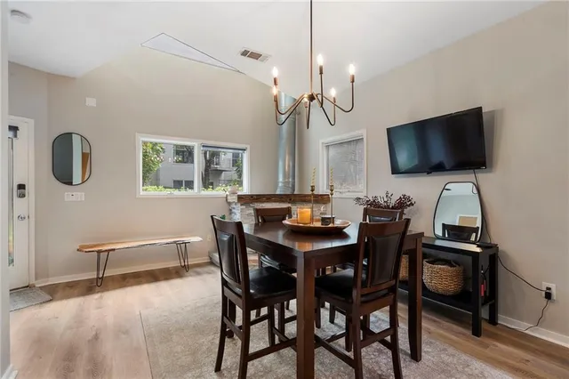 a view of a livingroom with furniture and a flat screen tv