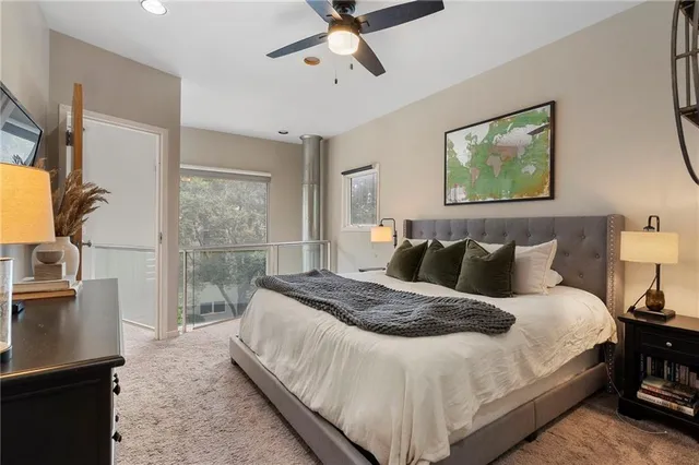 a view of walk in closet with clothes