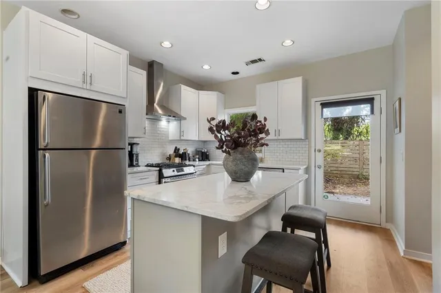 a kitchen with refrigerator a sink and a refrigerator
