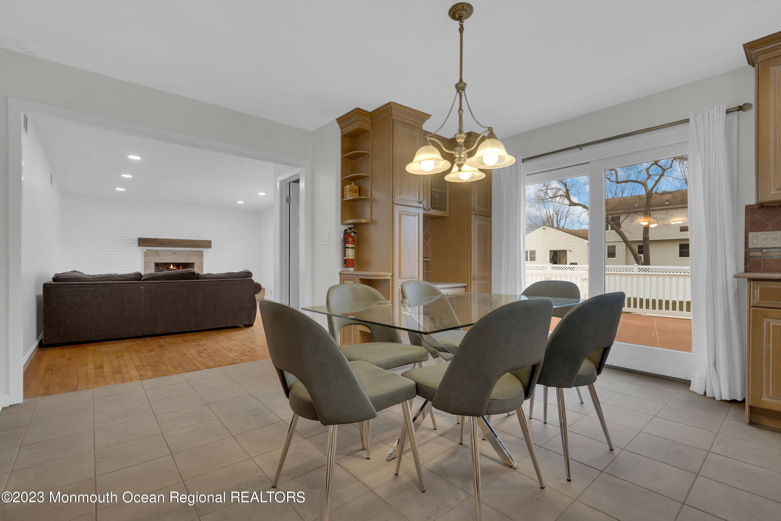 65 Fulton Avenue West Long Branch, NJ 07764 - Photo 13 of 35 a living room with furniture and a chandelier