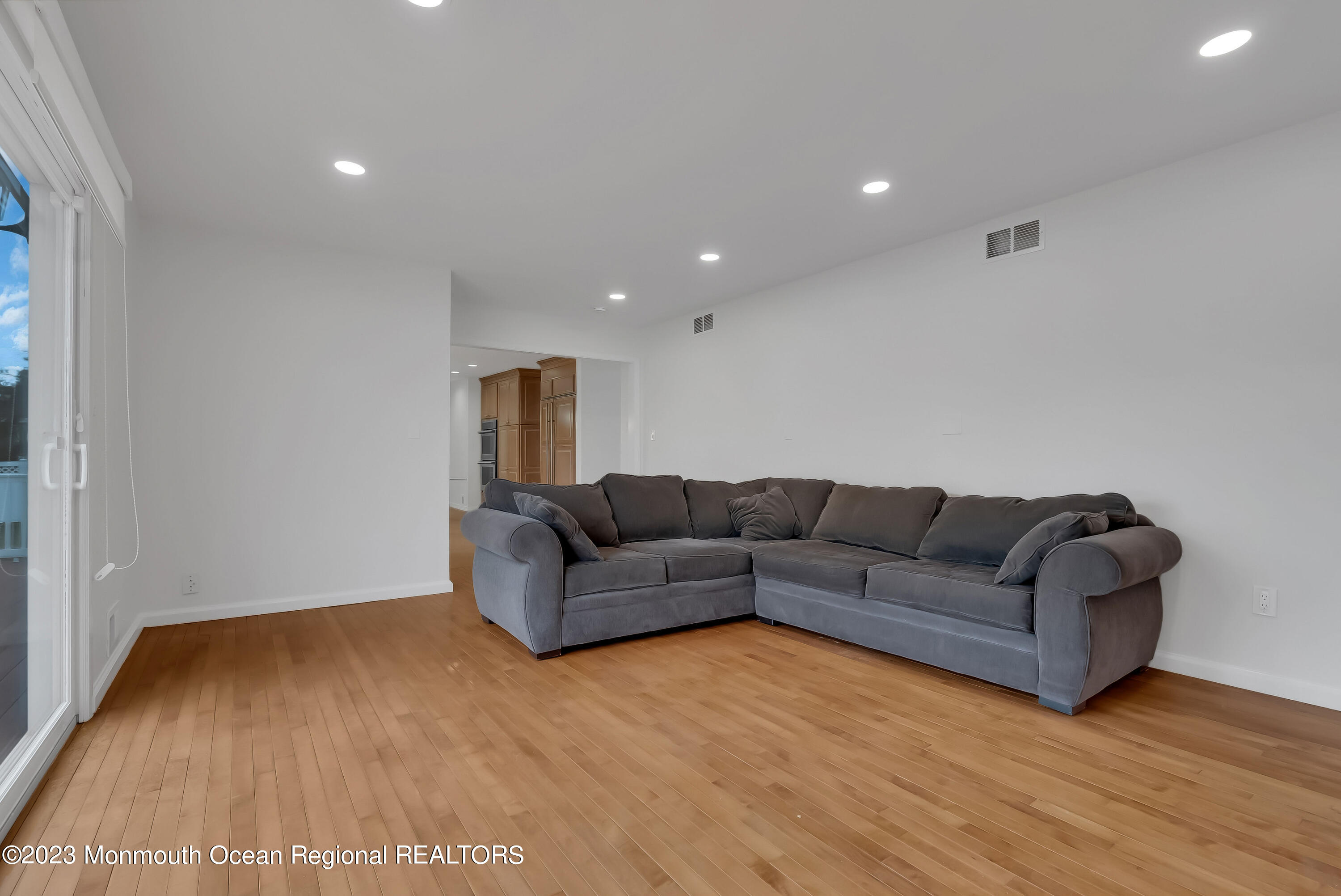 65 Fulton Avenue West Long Branch, NJ 07764 - Photo 16 of 35 a living room with furniture and a wooden floor