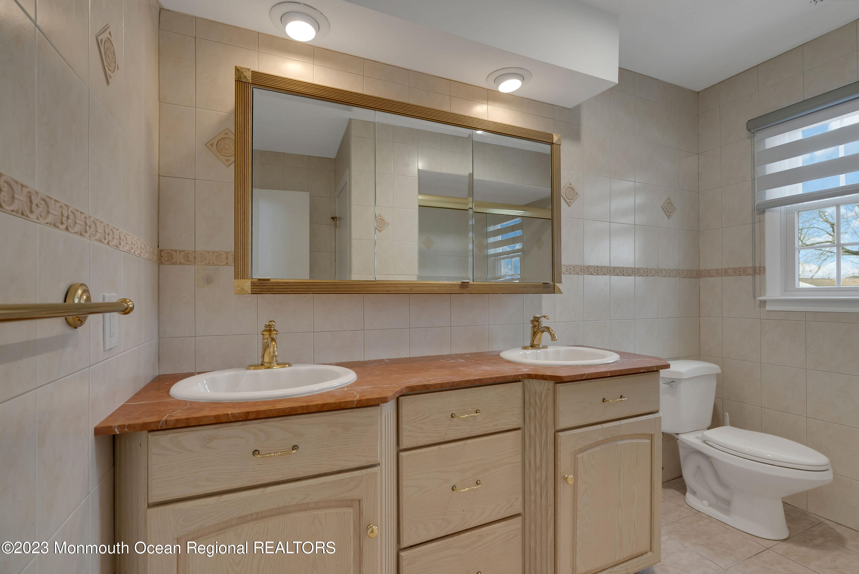 65 Fulton Avenue West Long Branch, NJ 07764 - Photo 24 of 35 a bathroom with a toilet sink and mirror