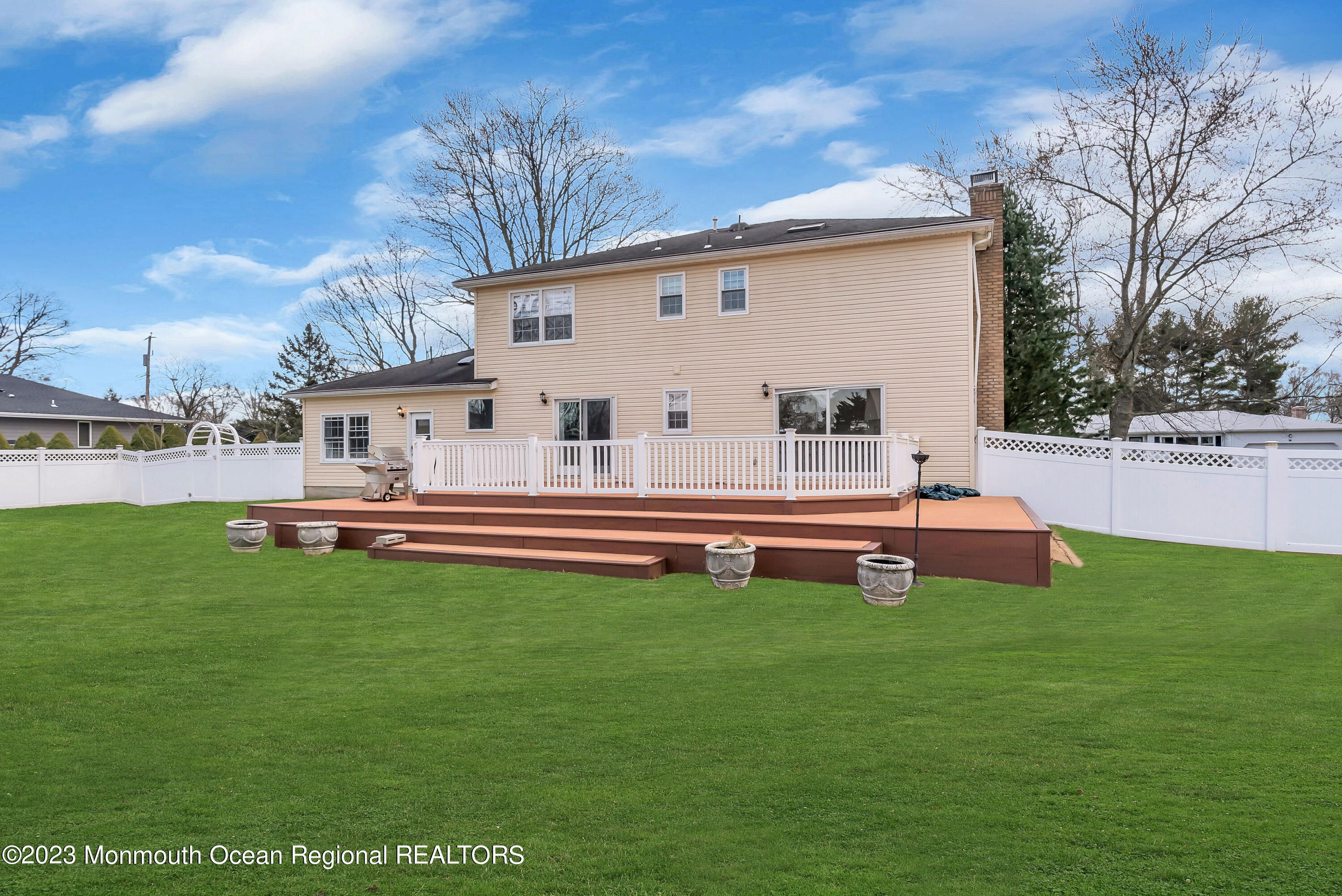 65 Fulton Avenue West Long Branch, NJ 07764 - Photo 28 of 35 a backyard of a house with table and chairs