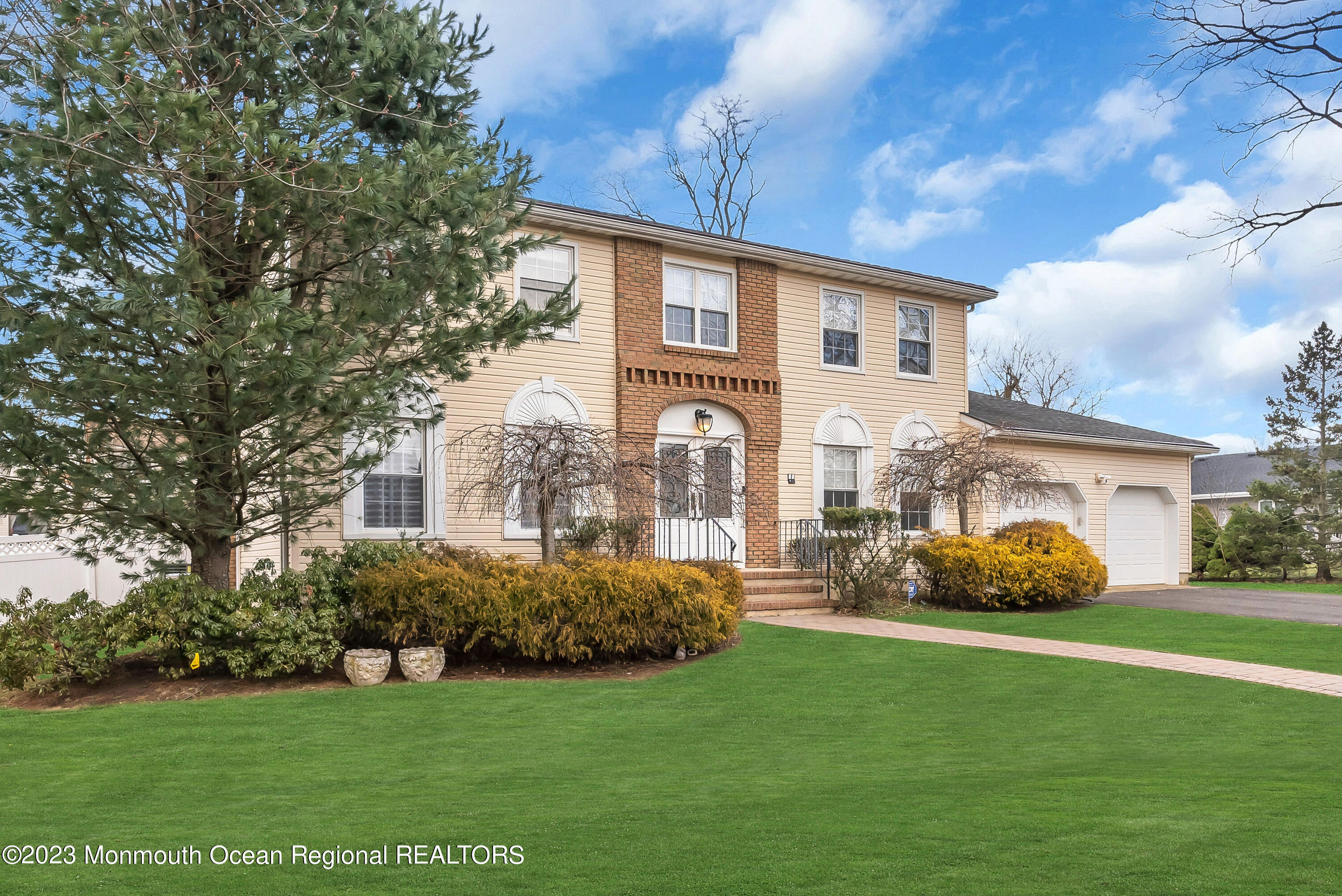 65 Fulton Avenue West Long Branch, NJ 07764 - Photo 32 of 35 a front view of a house with garden