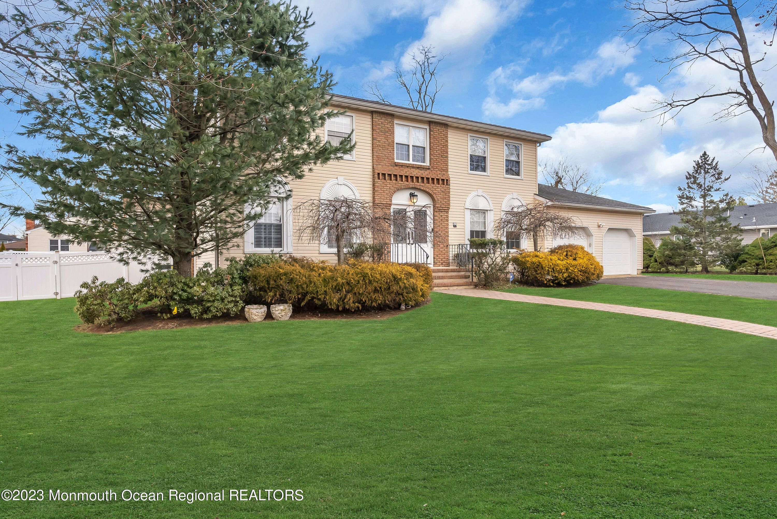 65 Fulton Avenue West Long Branch, NJ 07764 - Photo 33 of 35 a front view of a house with garden