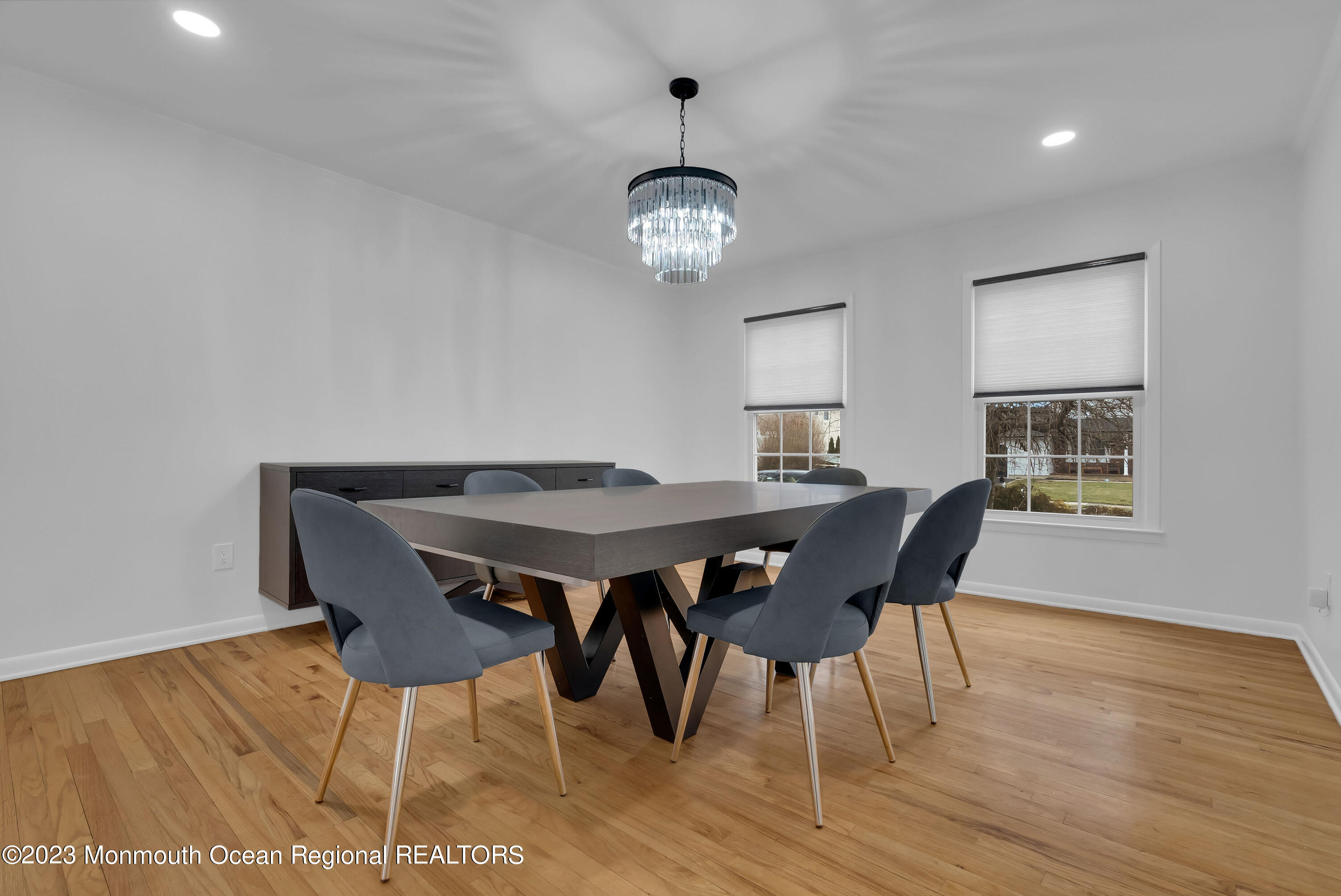 65 Fulton Avenue West Long Branch, NJ 07764 - Photo 6 of 35 a view of a dining room with furniture a chandelier and wooden floor