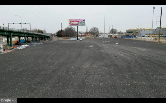 a view of a city street with an ocean view