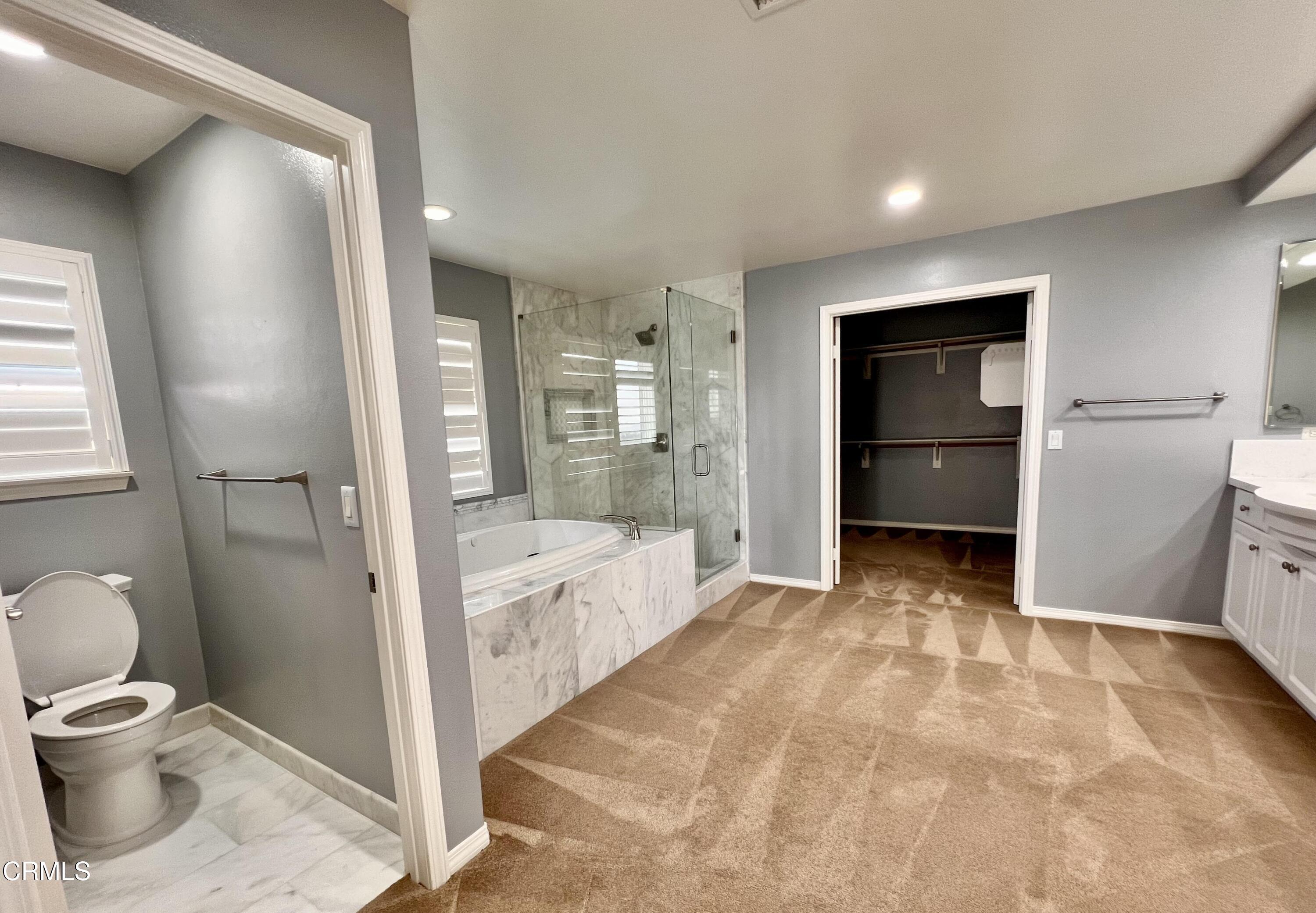 652 Corte Elegante Camarillo, CA 93010 - Photo 11 of 18 a bathroom with a sink and a large mirror
