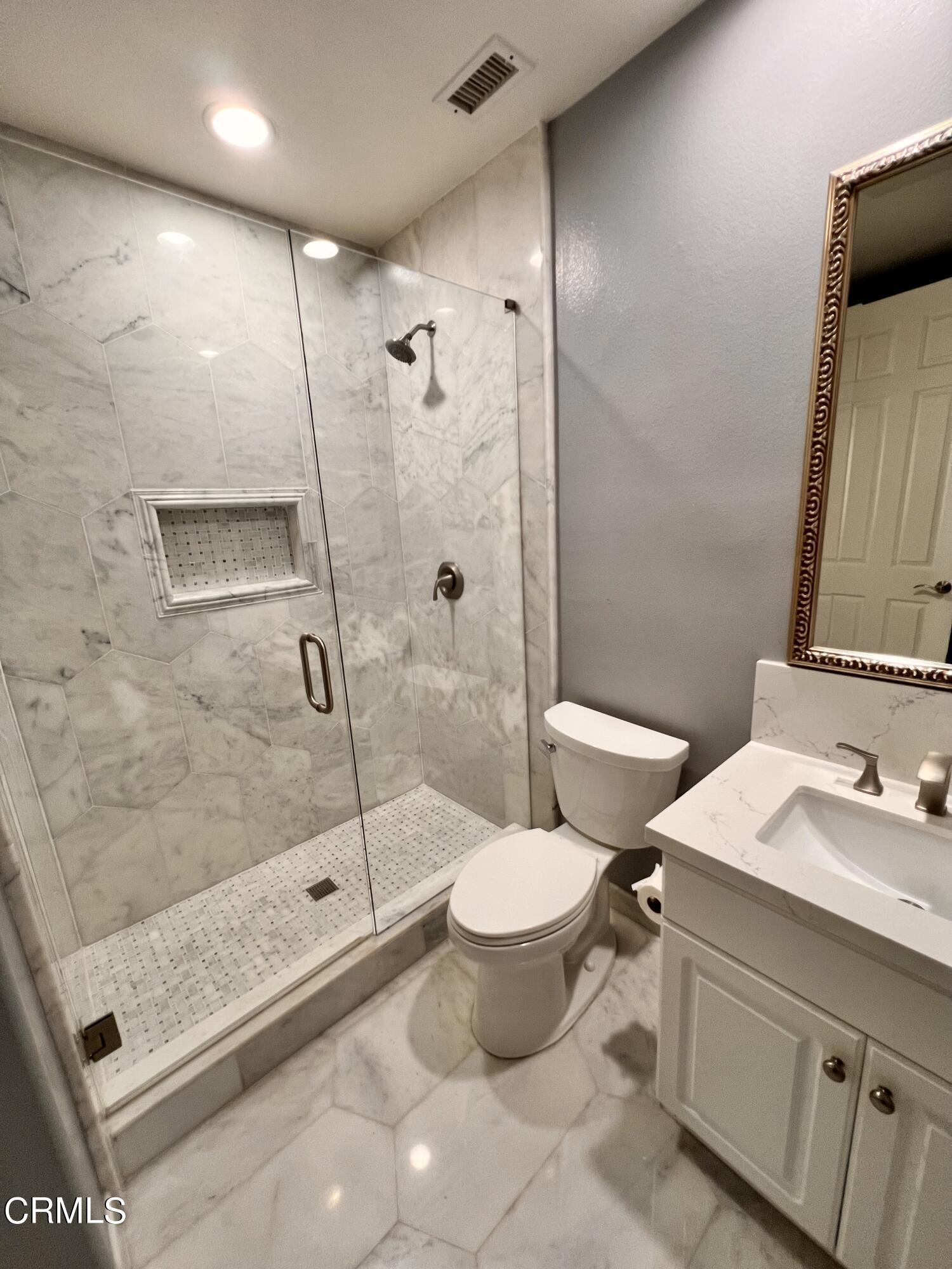 652 Corte Elegante Camarillo, CA 93010 - Photo 13 of 18 a bathroom with a sink toilet and shower