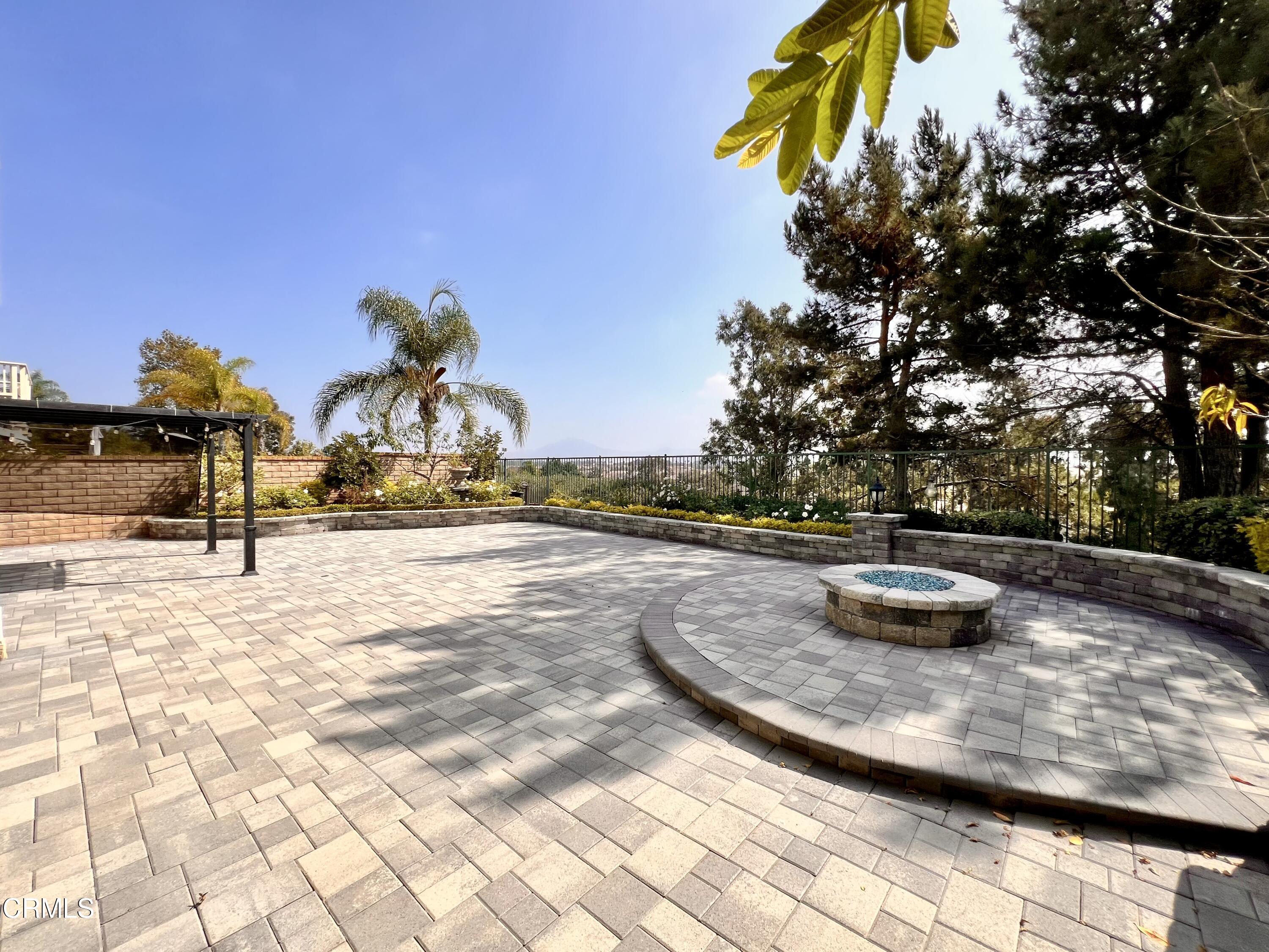 652 Corte Elegante Camarillo, CA 93010 - Photo 18 of 18 a view of a swimming pool with some potted plants