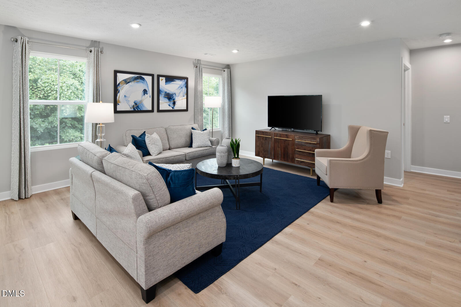 505 Matthiola Drive Wendell, NC 27591 - Photo 13 of 35 a living room with furniture wooden floor and a flat screen tv