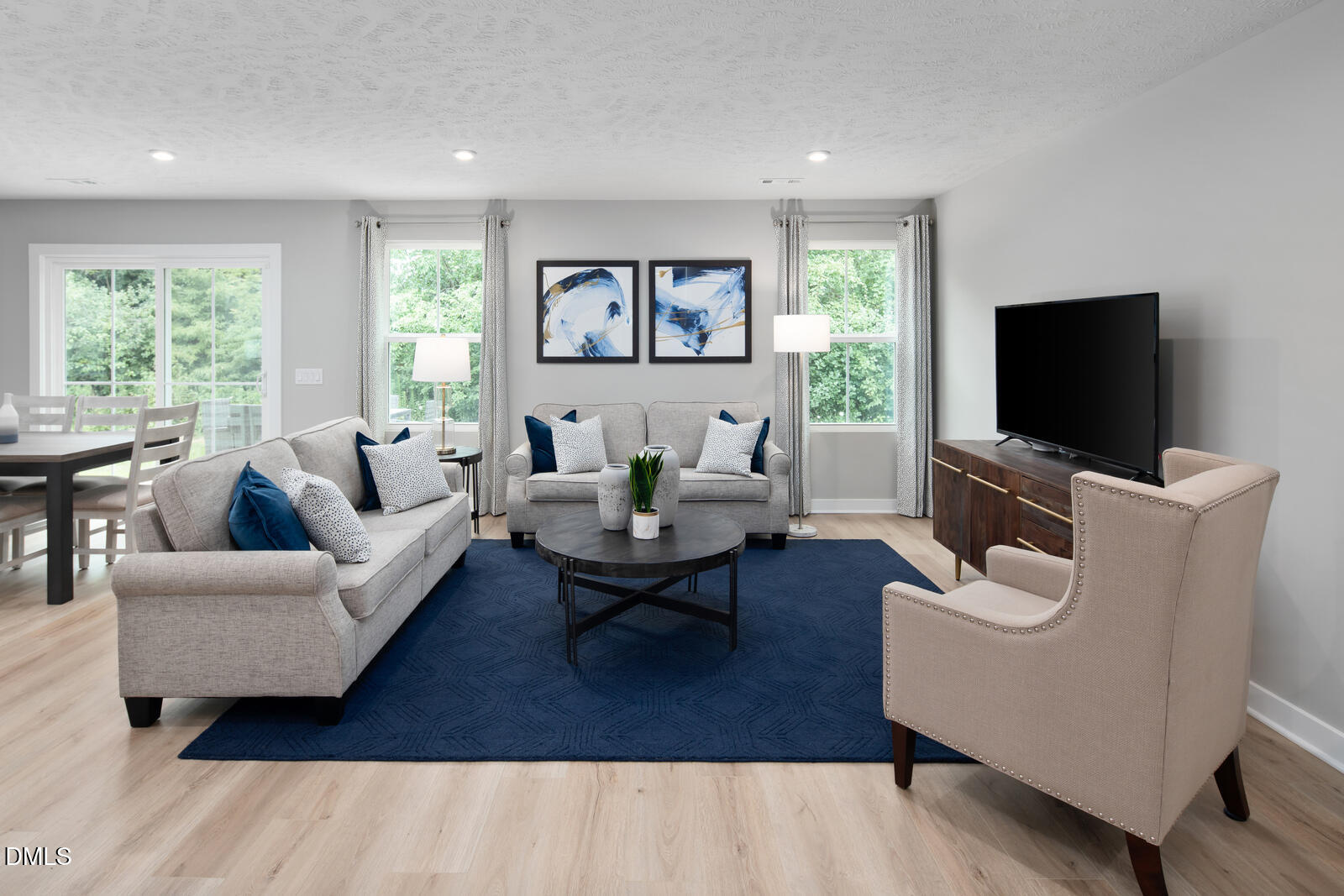 505 Matthiola Drive Wendell, NC 27591 - Photo 14 of 35 a living room with furniture and a flat screen tv