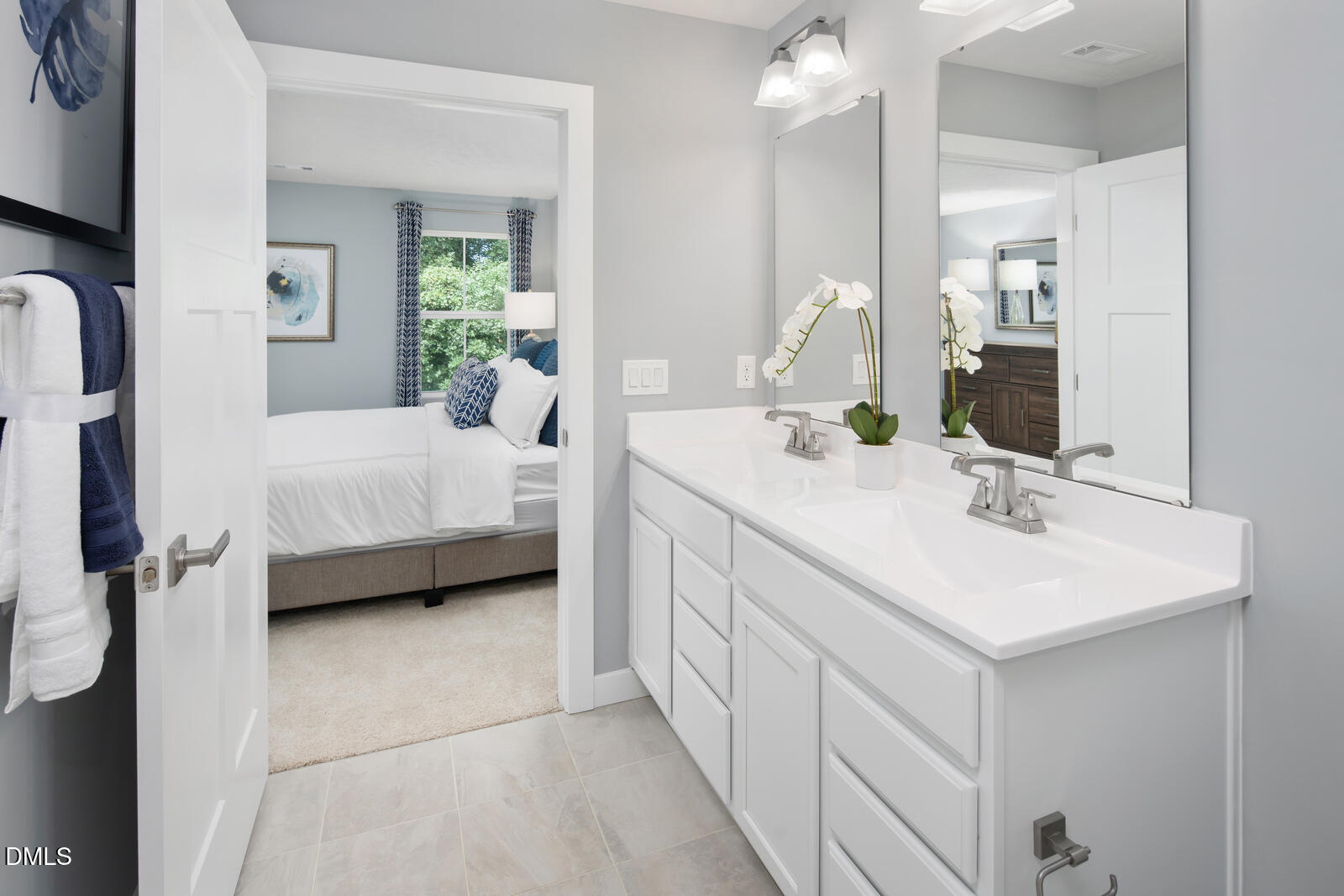 505 Matthiola Drive Wendell, NC 27591 - Photo 19 of 35 a en suite bathroom with a sink and a mirror