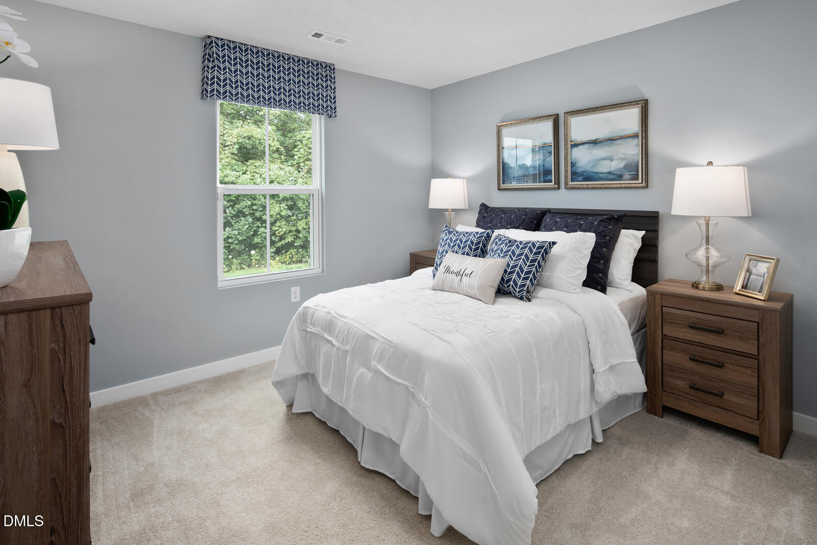 505 Matthiola Drive Wendell, NC 27591 - Photo 23 of 35 a bedroom with a bed and a window