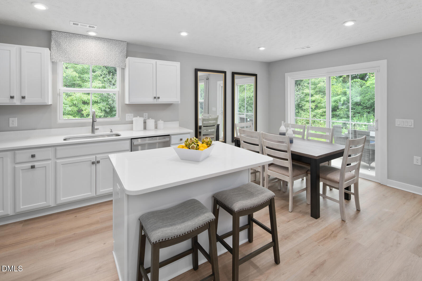 505 Matthiola Drive Wendell, NC 27591 - Photo 8 of 35 a kitchen with a table chairs sink and cabinets