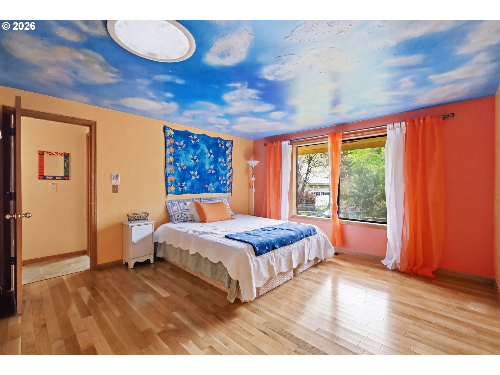 2983 Timberline Drive Eugene, OR 97405 - Photo 15 of 31 a bedroom with a large bed and wooden floor