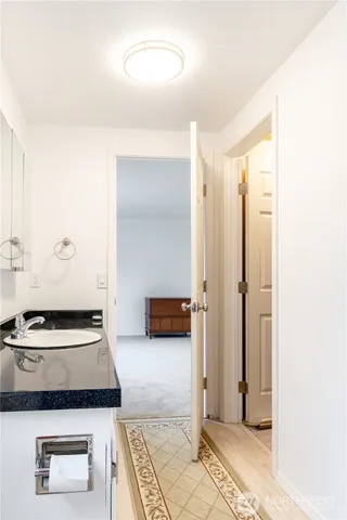 a bedroom with a bed and a walk in closet