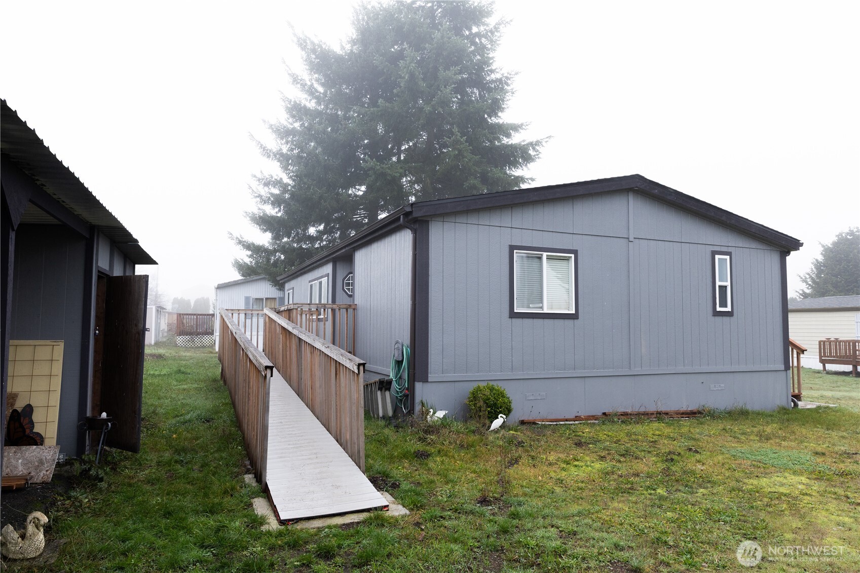 8915 Wilkensen Road Southeast, Unit 9B Yelm, WA 98597 - Photo 29 of 37 a backyard of a house with lots of green space