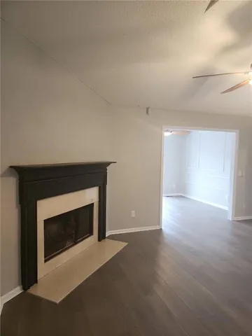 a view of empty room with a fireplace