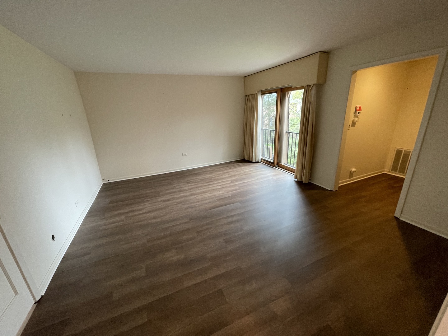 1119 Deerfield Road Deerfield, IL 60015 - Photo 14 of 30 an empty room with wooden floor and windows