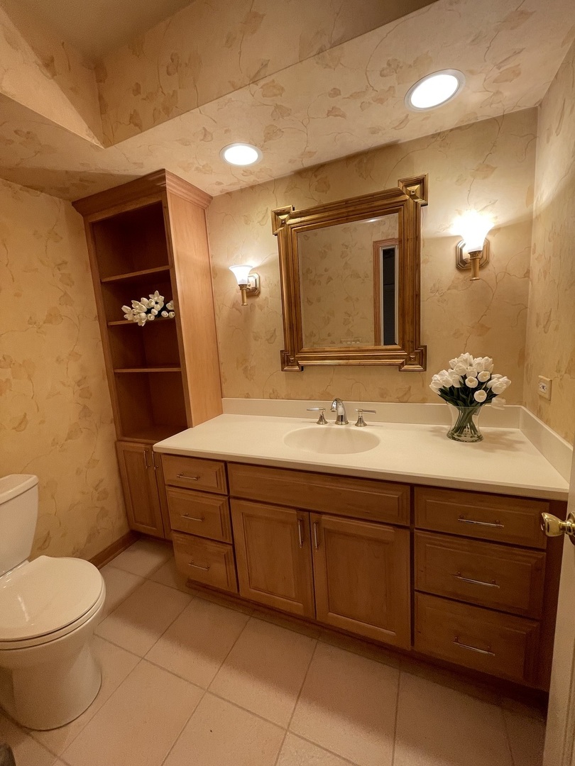 1119 Deerfield Road Deerfield, IL 60015 - Photo 7 of 30 a bathroom with a toilet sink and mirror