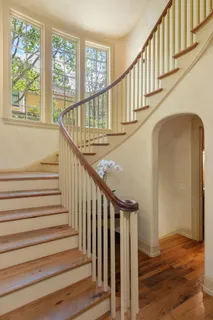 a view of living room with furniture and wooden floor