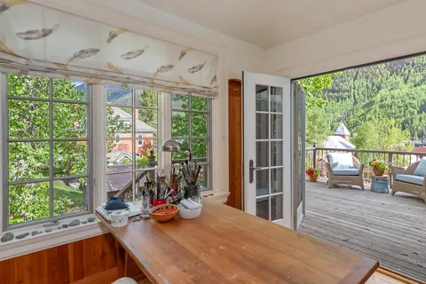 a living room with a large window and table