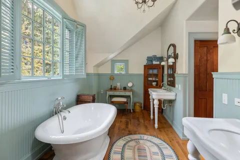 a bathroom with a sink and a window