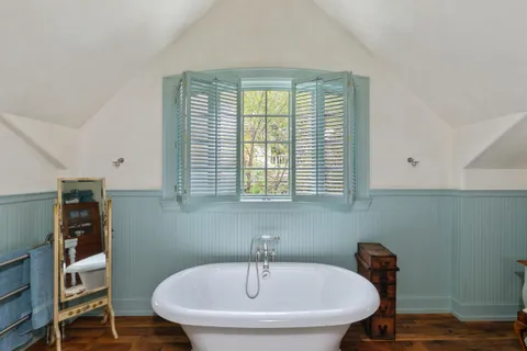 a view of a room with a table and chairs