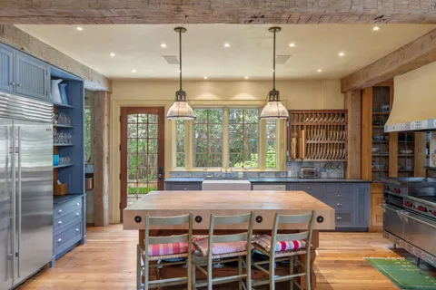 a open kitchen with a table and chairs