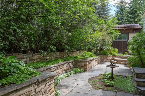 an aerial view of a house with a yard