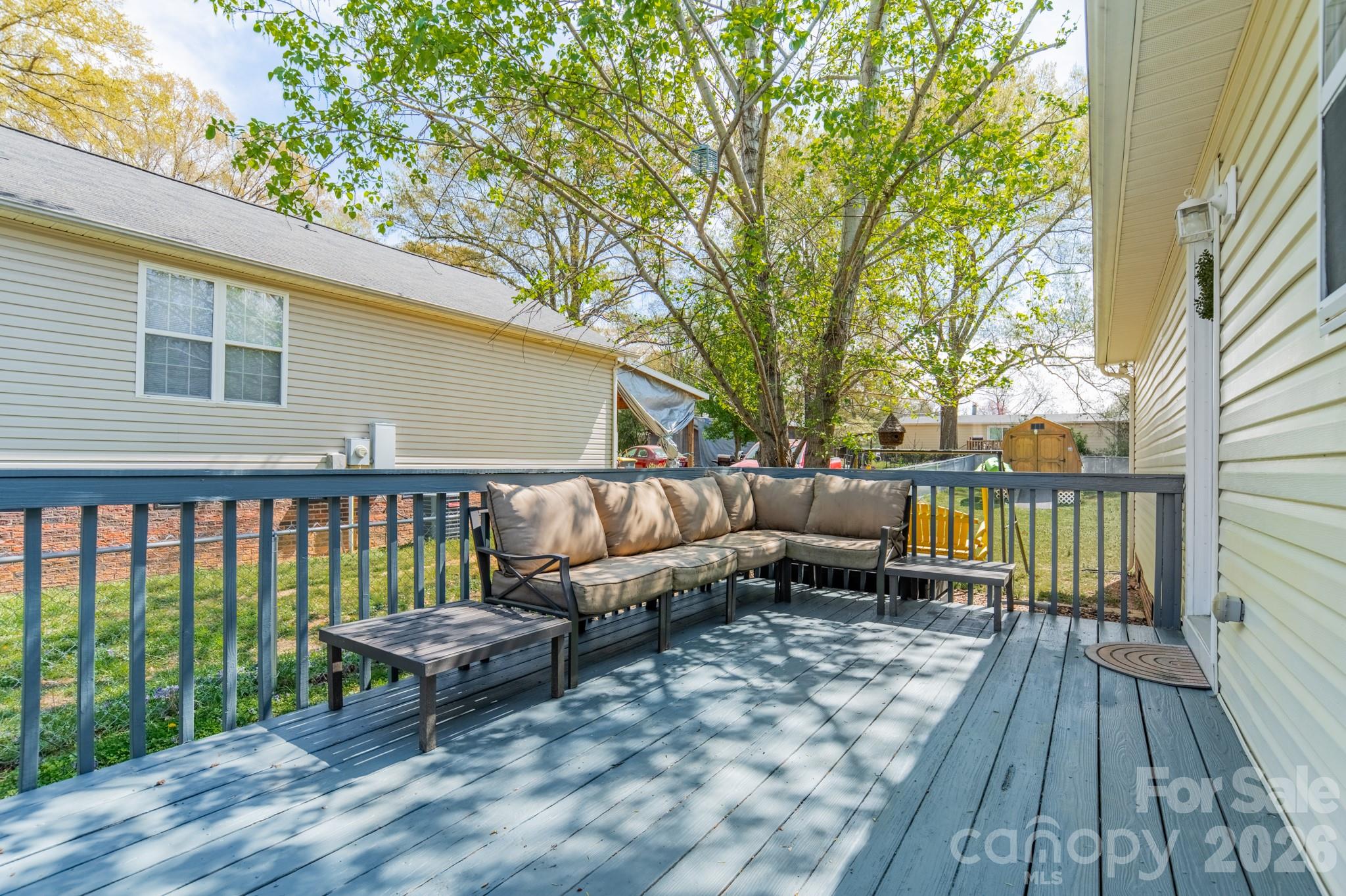 1015 South Walnut Street Kannapolis, NC 28081 - Photo 16 of 19 a roof deck with couches and wooden floor