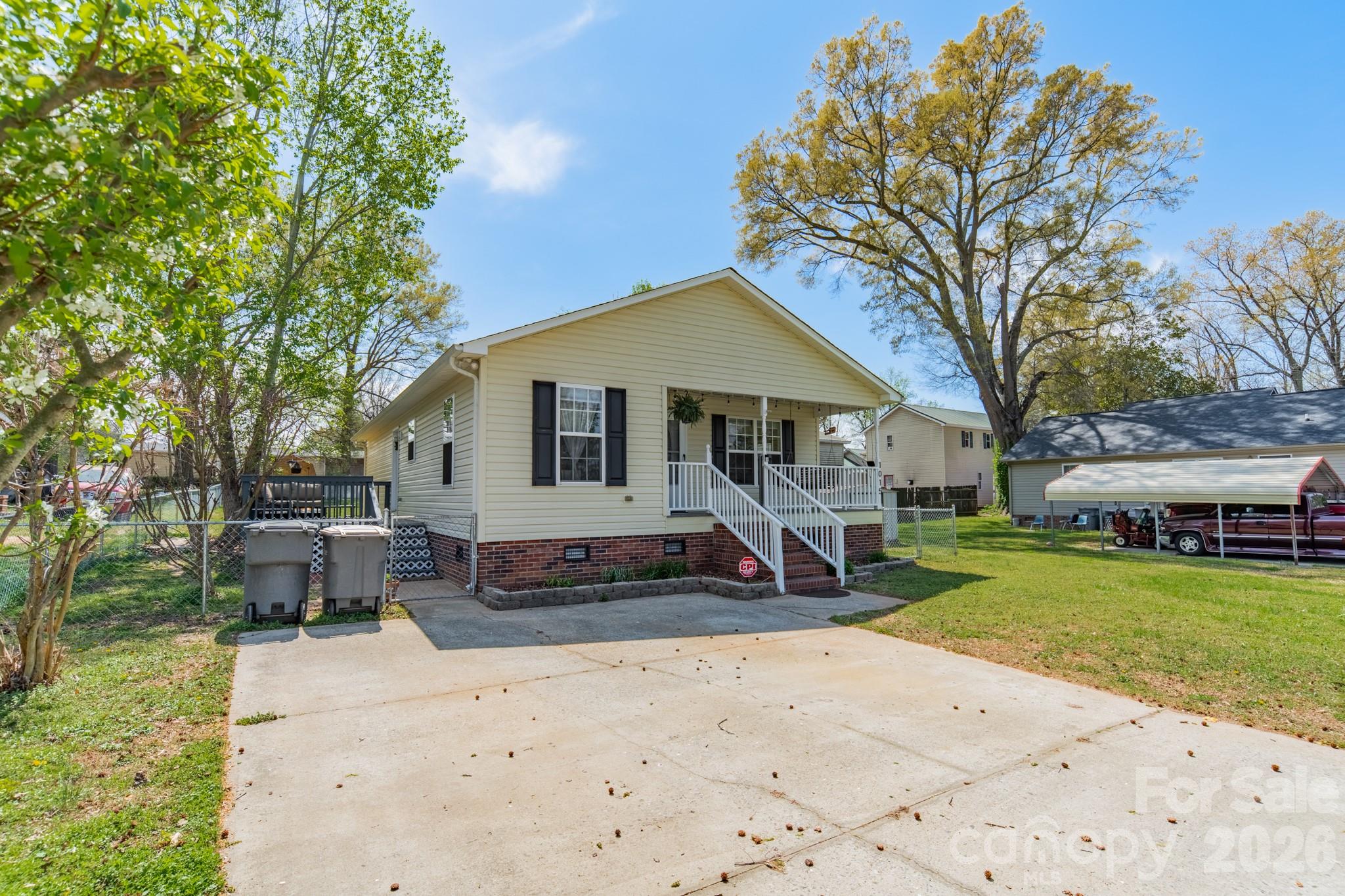 1015 South Walnut Street Kannapolis, NC 28081 - Photo 2 of 19 a front view of a house with a yard and garage