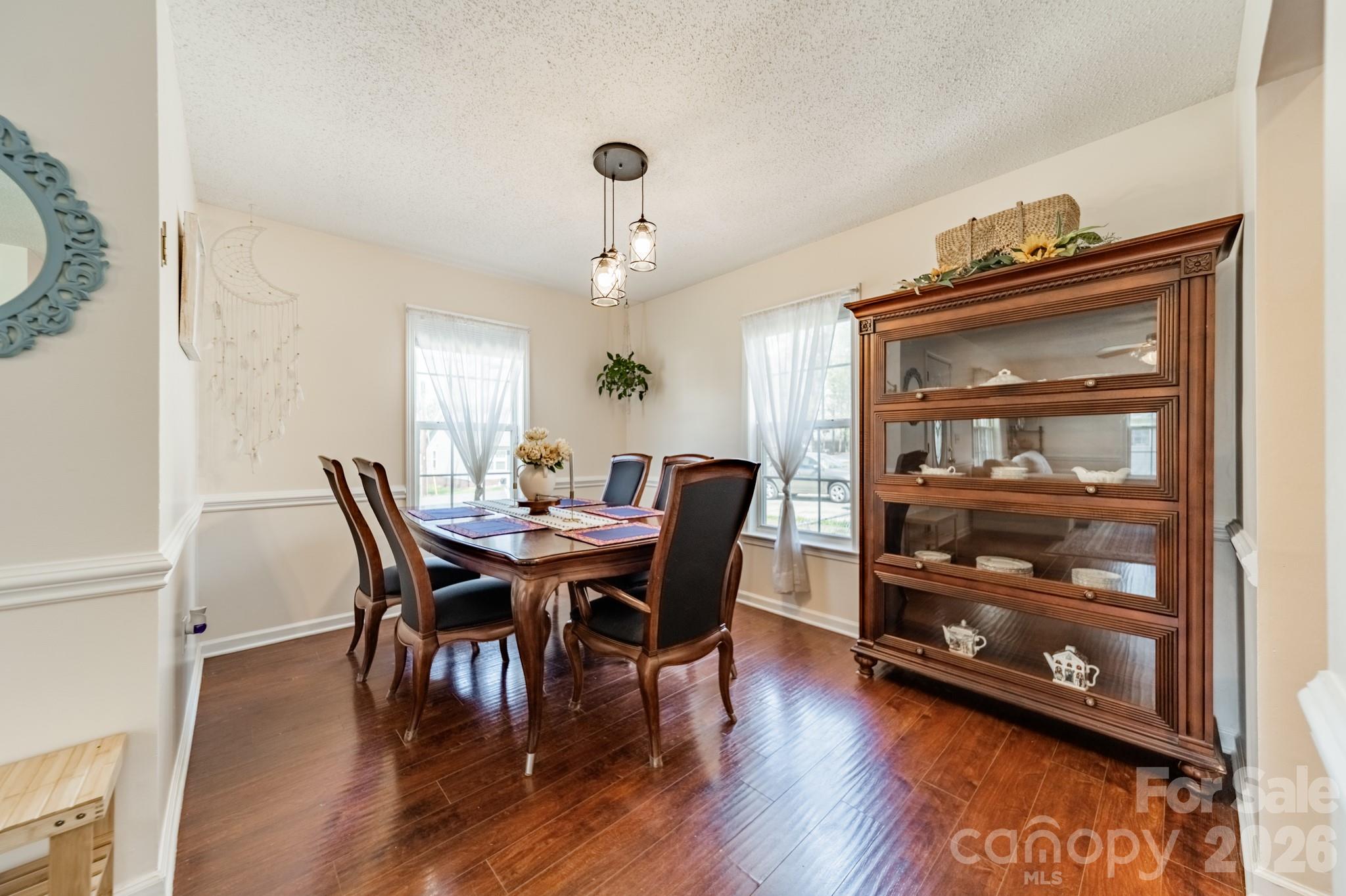 1015 South Walnut Street Kannapolis, NC 28081 - Photo 6 of 19 a view of a dining room with furniture and wooden floor