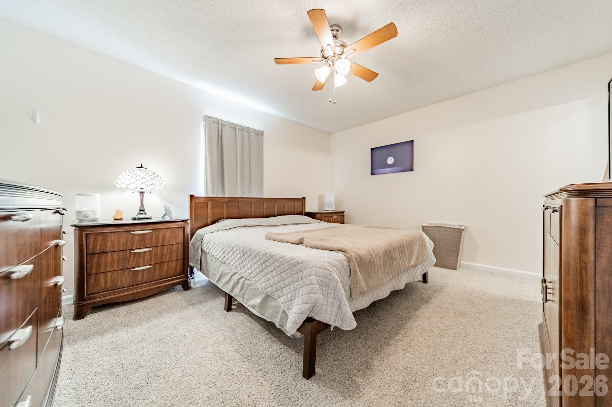 1015 South Walnut Street Kannapolis, NC 28081 - Photo 10 of 19 a bedroom with a bed dresser and a window