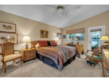 a spacious bedroom with a bed and window