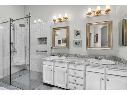 a bathroom with a double vanity sink mirror and double