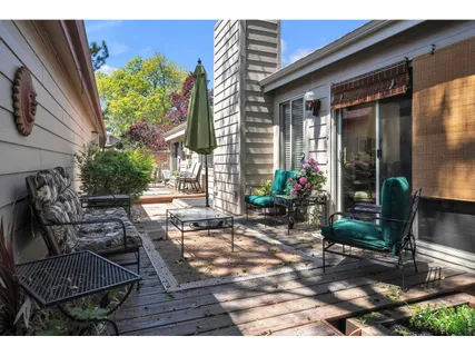 a backyard of a house with outdoor seating