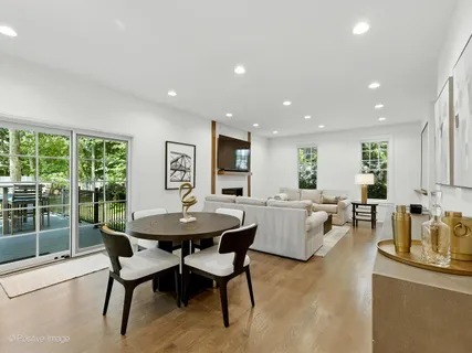 a kitchen with sink cabinets and wooden floor