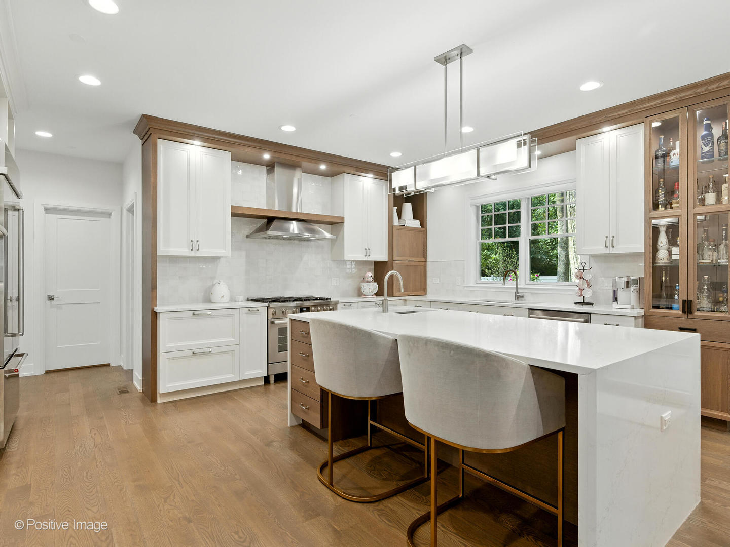 1150 Highland Avenue Lake Forest, IL 60045 - Photo 17 of 63 a kitchen with kitchen island a table and chairs in it