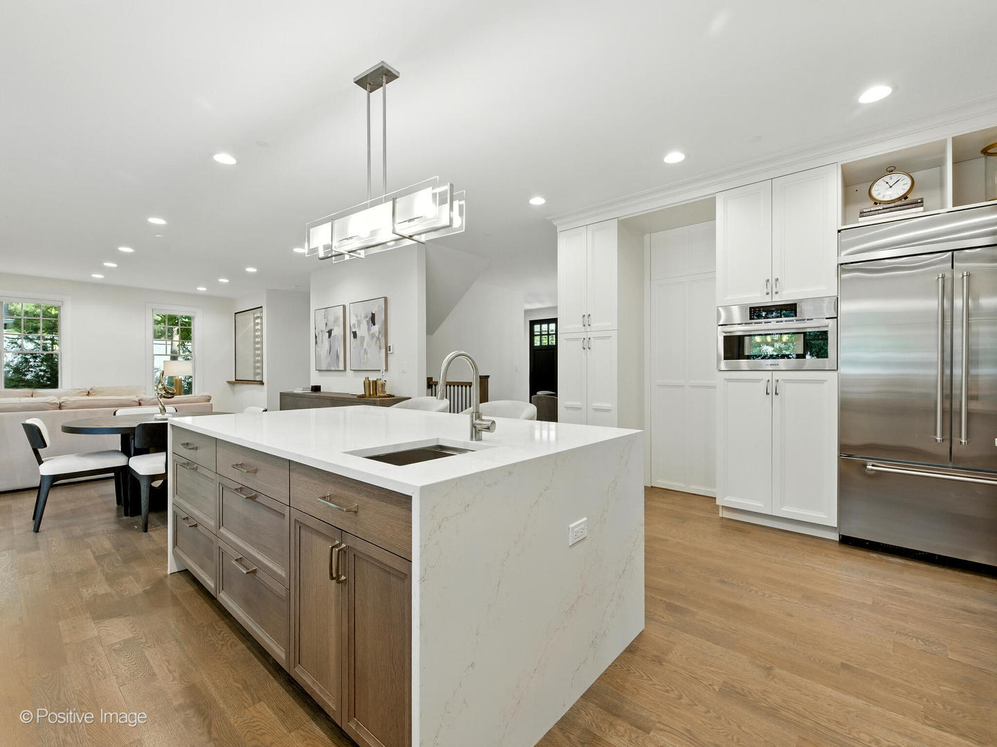 1150 Highland Avenue Lake Forest, IL 60045 - Photo 19 of 63 a kitchen with kitchen island a sink stove and refrigerator