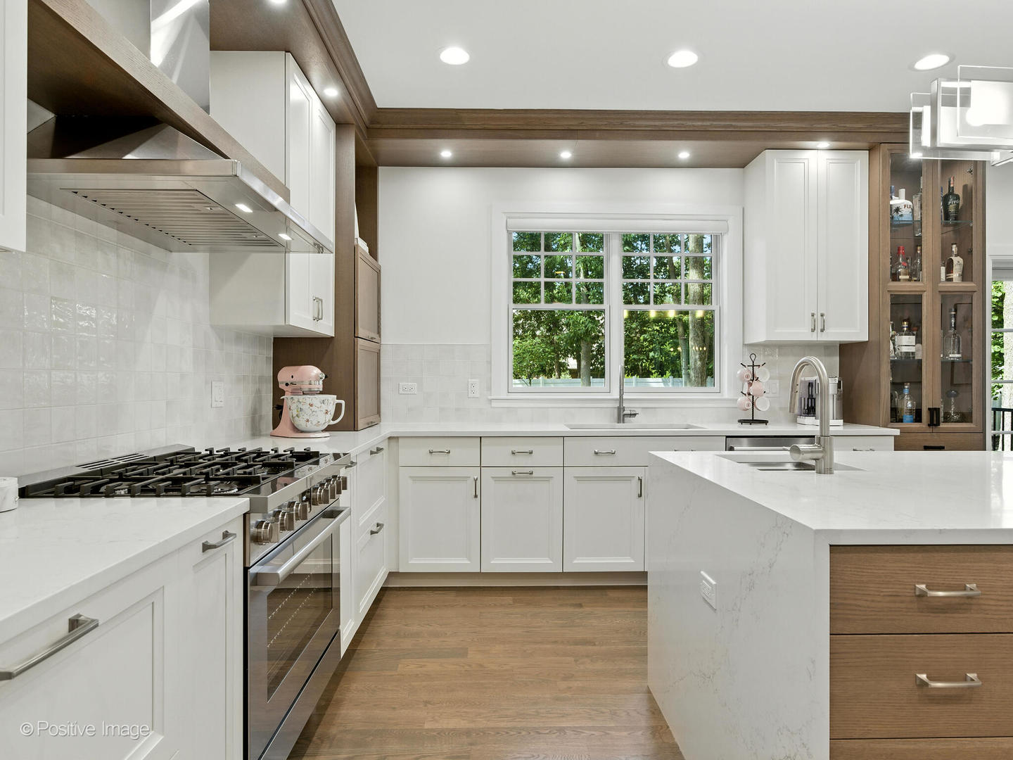1150 Highland Avenue Lake Forest, IL 60045 - Photo 22 of 63 a kitchen with a stove a sink and a window