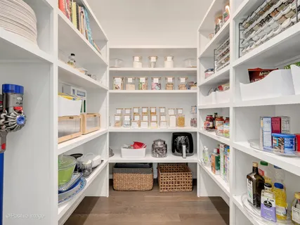 a bedroom with a bed and a television