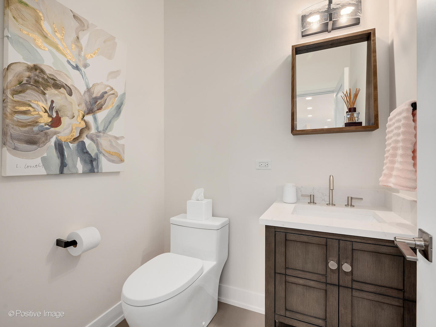 1150 Highland Avenue Lake Forest, IL 60045 - Photo 26 of 63 a bathroom with a toilet sink and mirror